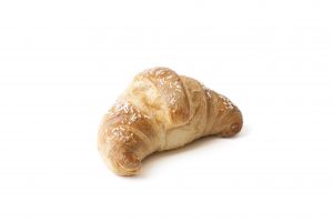 Croissant Cornaretto croissant Regina with custard filling, glazed surface. Ready-to-bake confectionery product, raw and frozen.