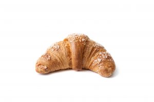 Croissant Cornaretto Regina with apricot filling, glazed surface. Ready-to-bake confectionery product, raw and frozen.
