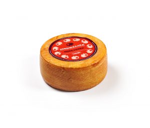 Salcis pecorino tinto rosso. The cheese is covered with a concentrate sun dry tomatoes paste, which is manually rubbed around the cheese.​