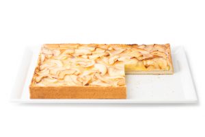 Maxi apple cake. Frozen pastry product. Short crust pastry base filled with apricot jam, custard cream, sponge cake and apple.
