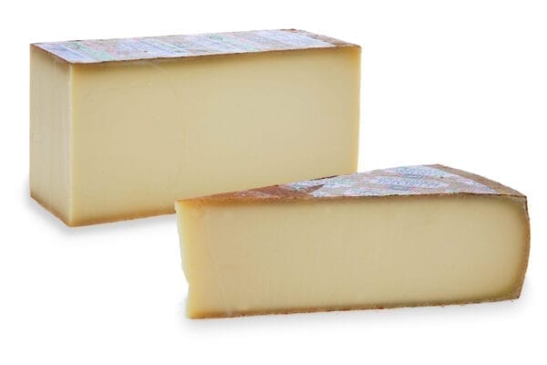Gruyere riserva wedge. Hard yellow Swiss cheese, firm with a pale yellow colour & a rich, creamy, slightly nutty taste