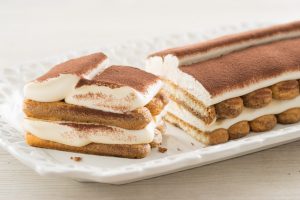 Tiramisu' classico. Two layers of ladyfingers dipped in coffee with two layers of mascarpone cream and Marsala, in a very elegant shape.